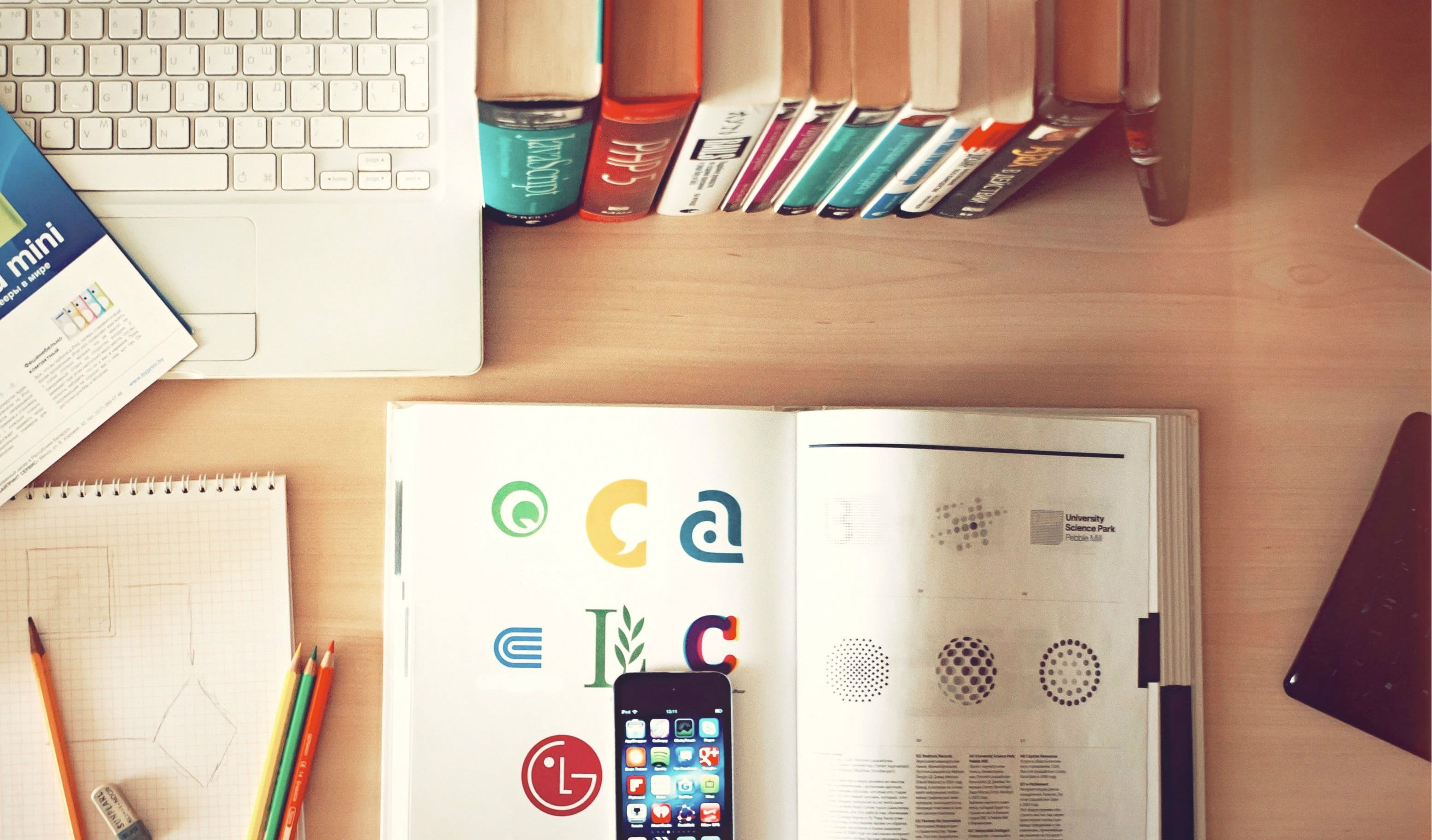 laptop-iphone-books-desk twitter cropped