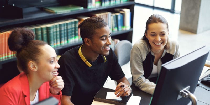 Three students on computer 800 x 400